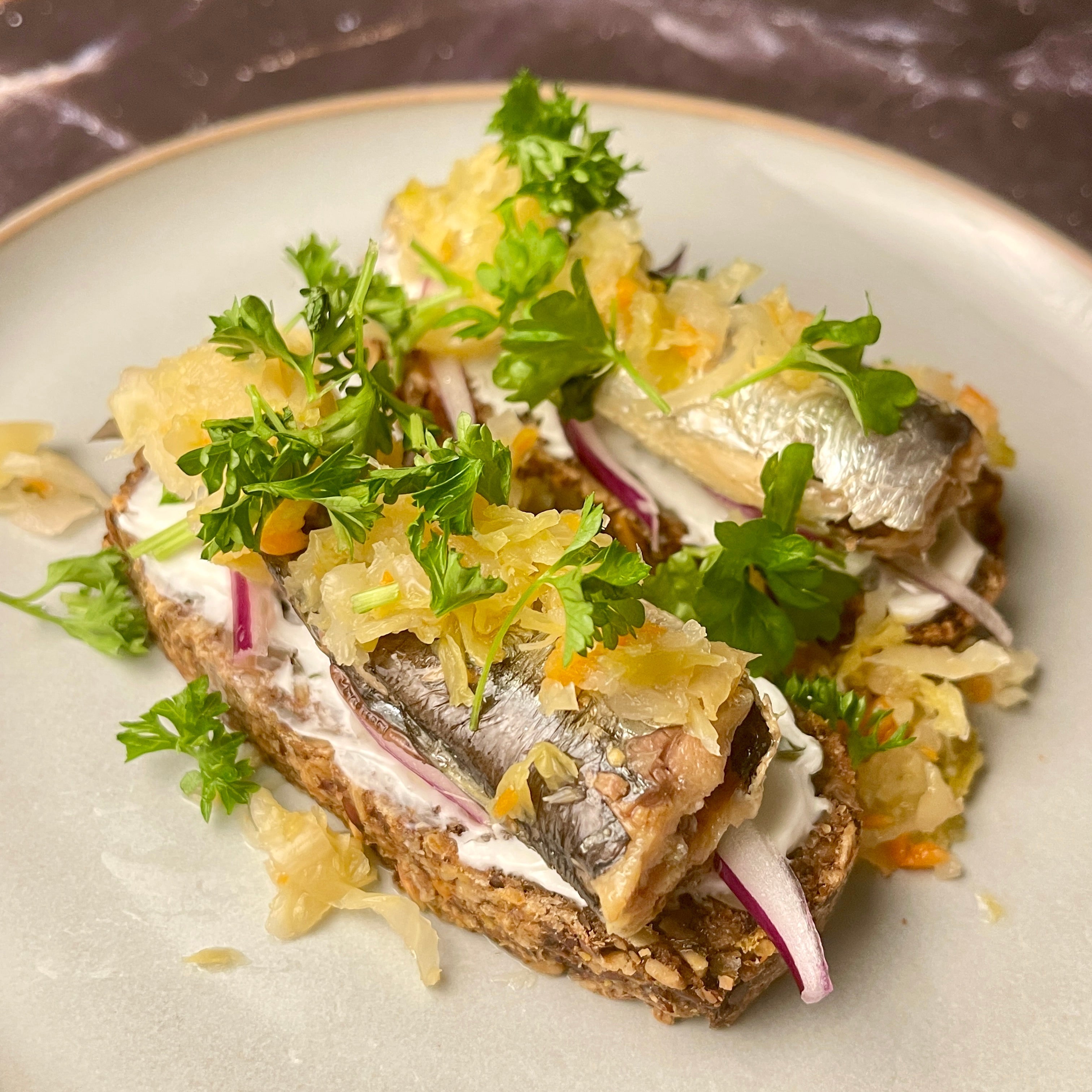 Sardine Open Rye with Cream Cheese, Kimchi and Parsley